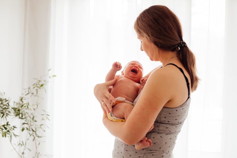 woman-holding-crying-baby