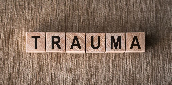 the-word-trauma-spelled-out-with-wooden-blocks